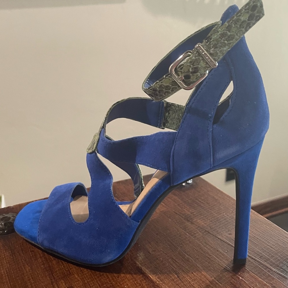 Royal blue and snakeskin heels gently used .
